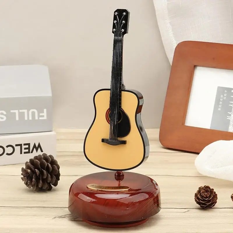 Miniaturgitarre, klassische Gitarre, rotierende Musikbox!