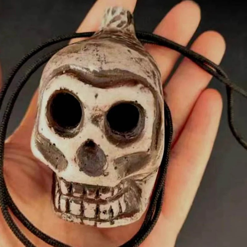 Prächtige Ocarina Menschenschädel Pfeife des makabren Lachens