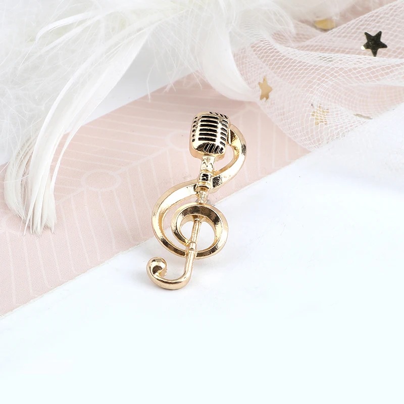 Emaille Pins Mikro Musiknote in Goldfarbe