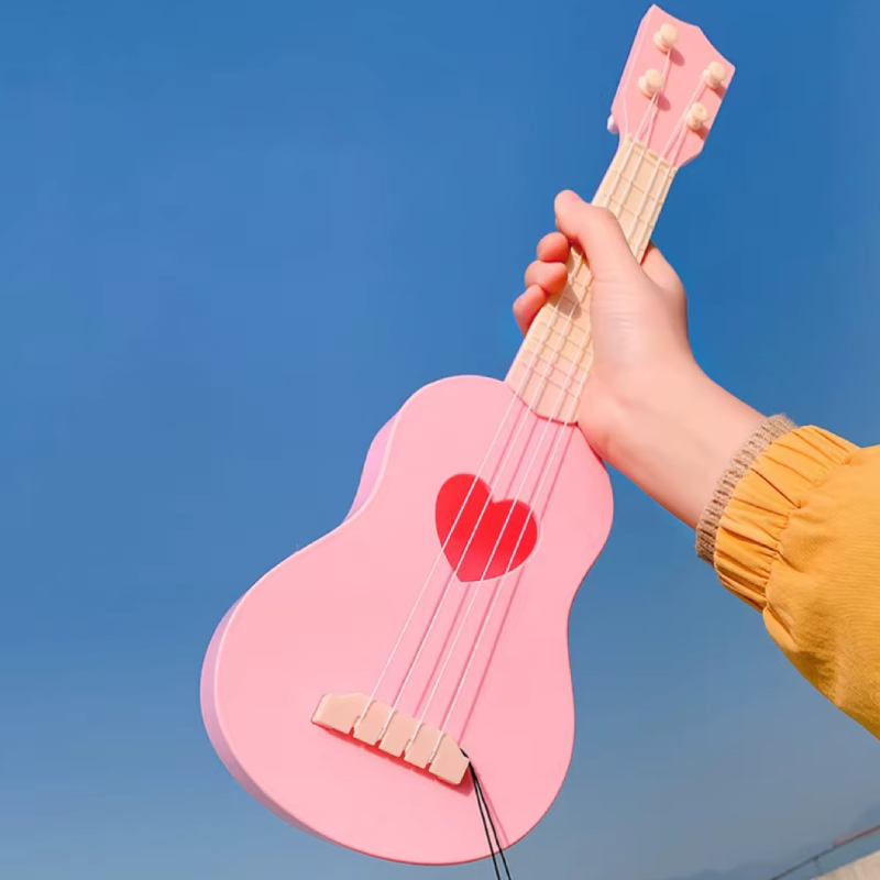 Kleine Gitarre für Kinder, wahlweise für Mädchen oder Jungen - Farbe Rosa