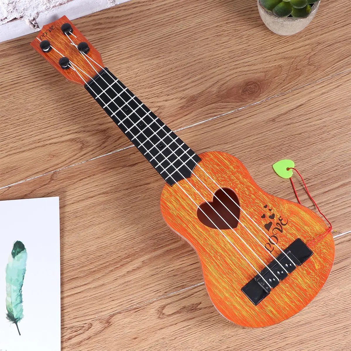 Details der Saiten des Kinder-Ukulele, perfektes Instrument für Kleinkinder