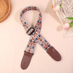 Vintage Gitarrengurt mit blauen und ockerfarbenen Arabesken